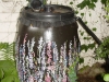 A painted rain barrel.