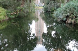 Bok Tower reflecting in a garden pond.