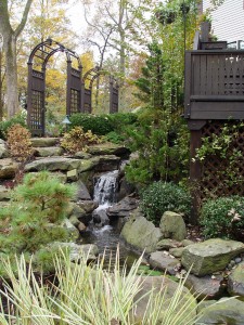 Hanselman Landscape turned this Lancaster County sloped, shaded side yard into a beautiful setting with arbors and a waterfall. turned this