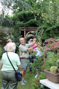 PHS Gold Medal Plant committee member Michael Colibraro shows visitors around his home garden near Philadelphia.