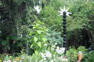 One of Buffalo's best-known garden focal points -- the bowling-ball totem pole.